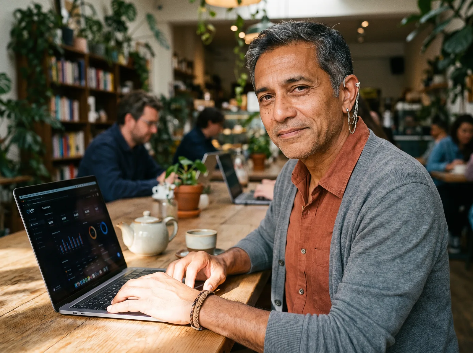 An engineer from Havenmark working in a coffee shop